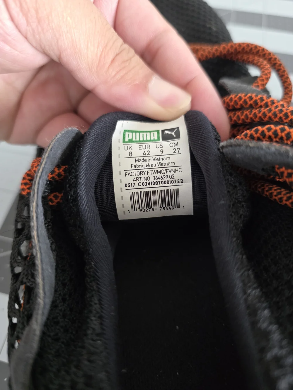 Puma Black Knit Sneakers with Orange Accents